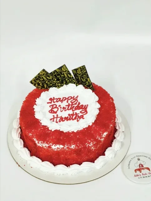Red velvet birthday cake with white cream piping